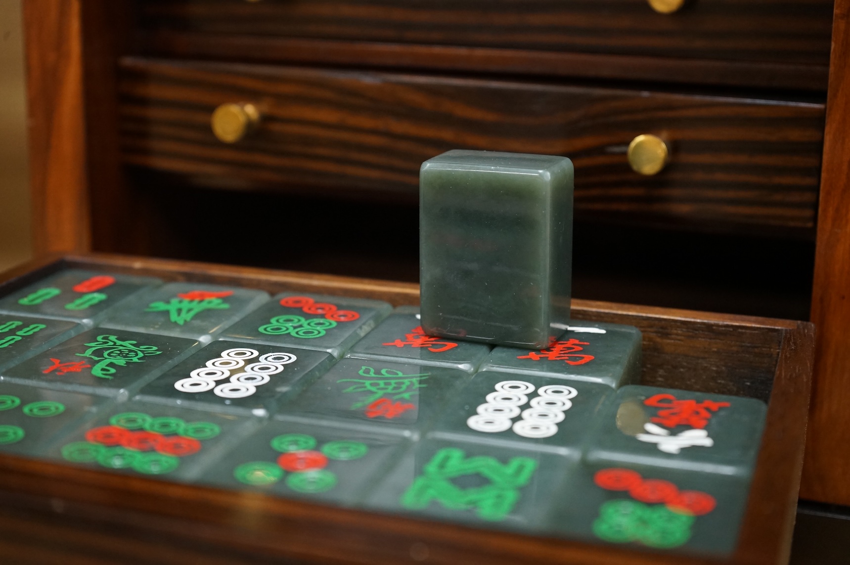 Two mahogany-cased hardstone mahjong sets, 22.5cm tall